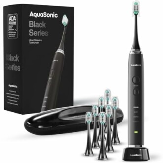 AquaSonic Black Series electric toothbrush with multiple brush heads and travel case.