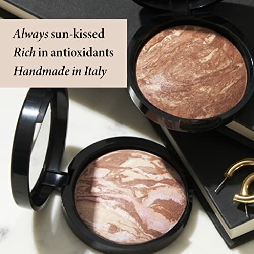 Two open compacts of marbled bronzer and highlighter makeup, showcasing the product's unique formula and pigments.