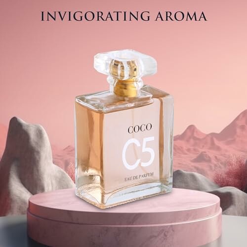 Coco C5 perfume bottle on a pink platform with scenic background