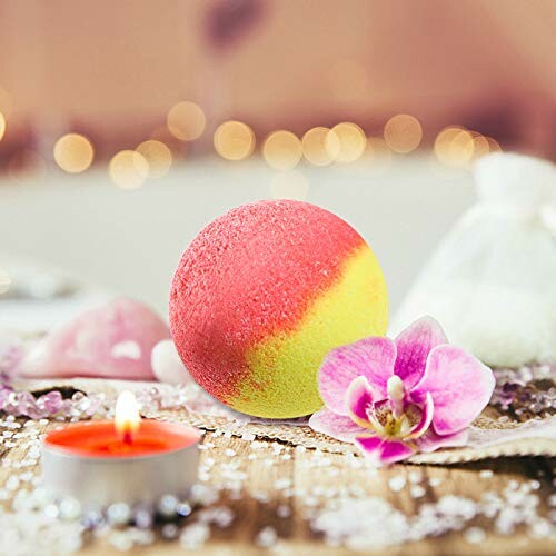 Colorful bath bomb with a candle and orchid