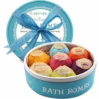 Set of colorful bath bombs in a gift box with a blue ribbon.