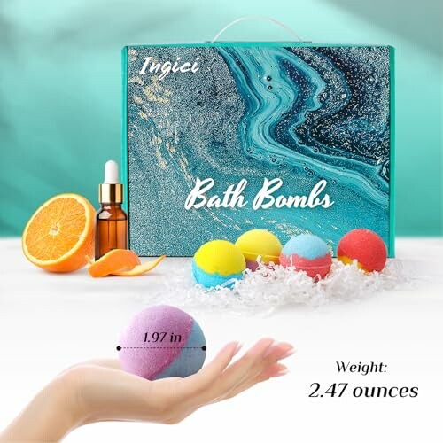 Colorful bath bombs with packaging and orange slice.