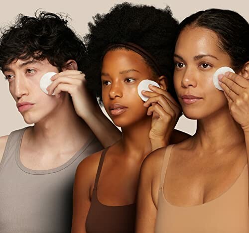 Three people using cotton pads on their faces.