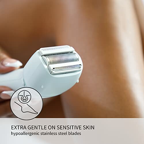 Electric razor with hypoallergenic stainless steel blades for sensitive skin.