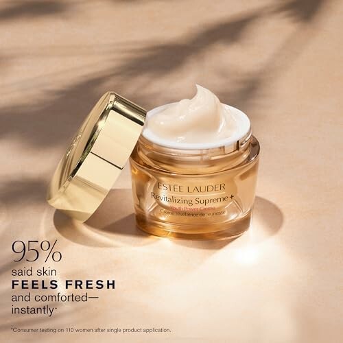 Estee Lauder Revitalizing Supreme+ cream jar with lid open.