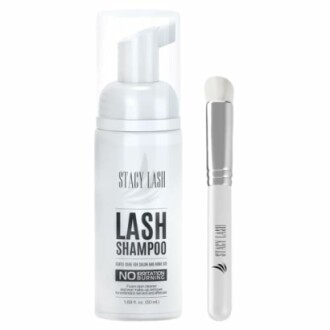 Eyelash shampoo bottle and applicator brush.