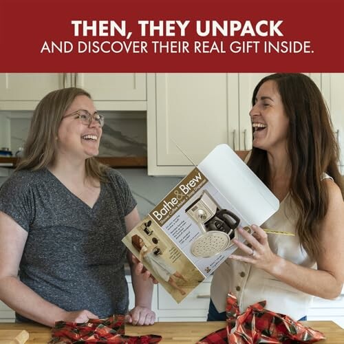 Two women laughing while holding a prank gift box labeled 'Bath & Brew'.