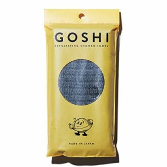 Goshi exfoliating shower towel in yellow packaging