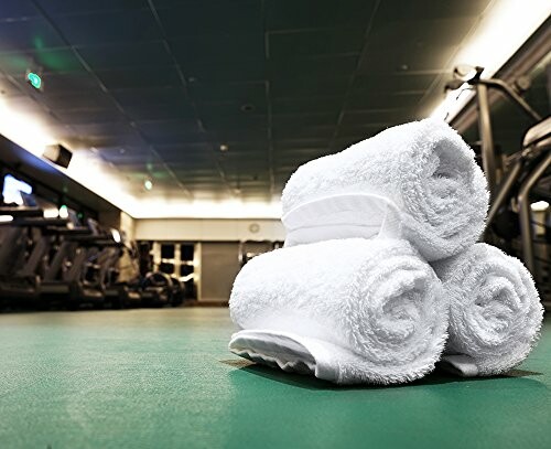 Stack of white towels on a gym floor