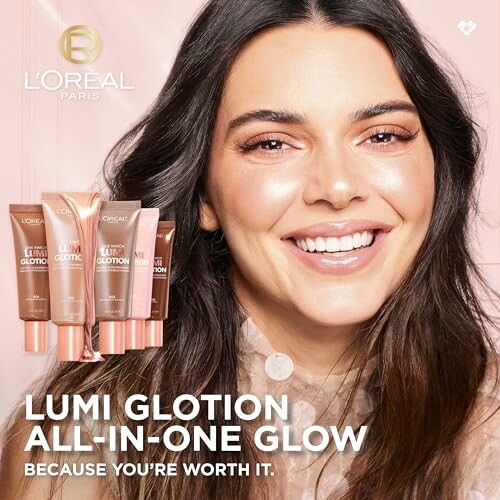 Smiling person with L'Oréal Lumi Glotion products