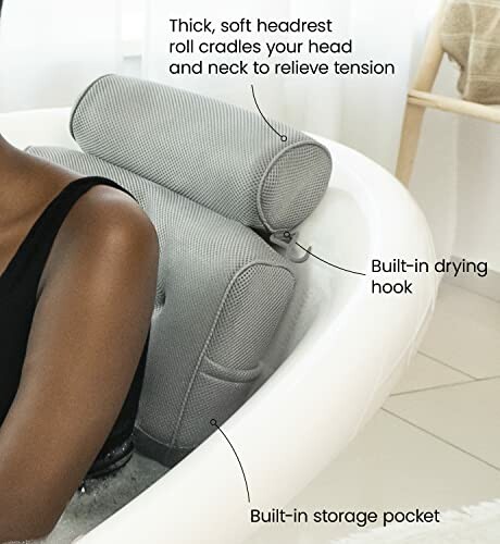 Luxury bath pillow with headrest and storage pocket in bathtub.