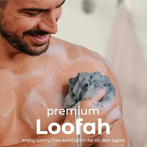 Man using a loofah with soap suds