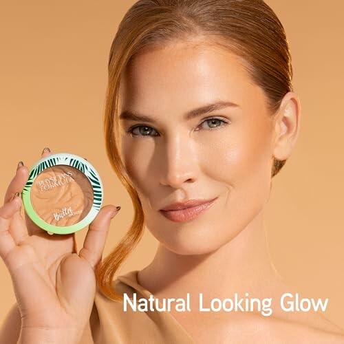 Woman holding butter bronzer with natural glow