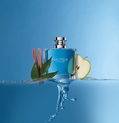 Voyage perfume bottle with apple and leaves on blue background