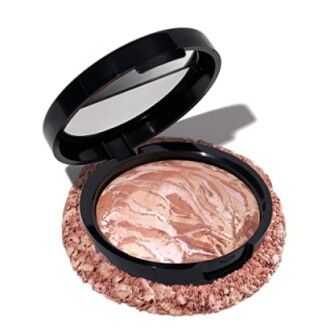 Open compact with marbled powder and mirror, showcasing the product's packaging and design.