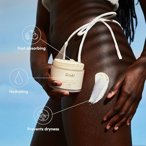 Person applying Ouai body cream on leg with benefits listed: fast absorbing, hydrating, prevents dryness.