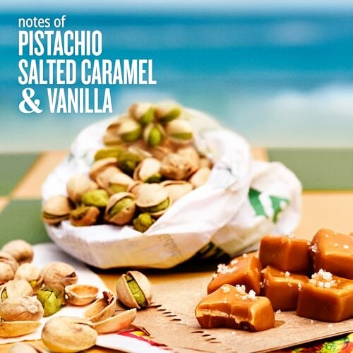 Pistachios and salted caramel on a table with sea background.