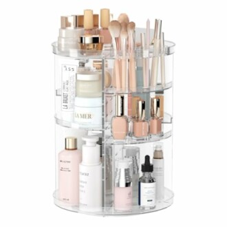 Rotating makeup organizer with cosmetics and brushes.