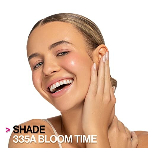 Smiling woman with makeup, shade 335A Bloom Time