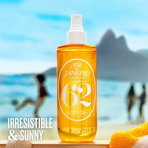 Sol de Janeiro perfume bottle on beach with ocean background.