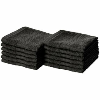 Stacks of black towels arranged neatly.