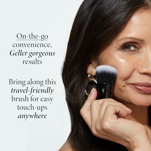 Woman using a travel-friendly makeup brush on her face.