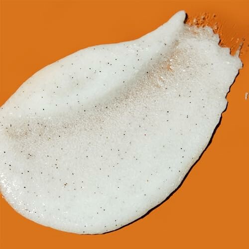 White cream texture on an orange background.