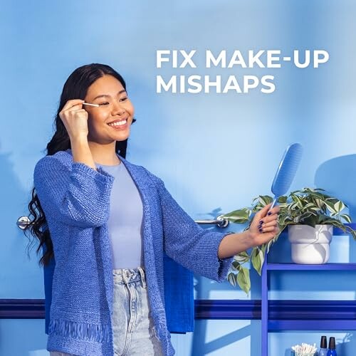 Woman using a makeup tool in front of a mirror with text 'Fix Make-up Mishaps'.