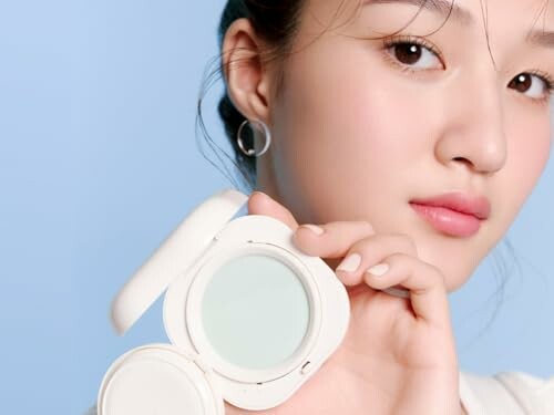 Woman holding a cosmetic compact