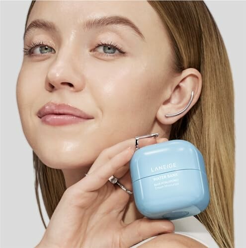 Woman holding Laneige Water Bank moisturizer