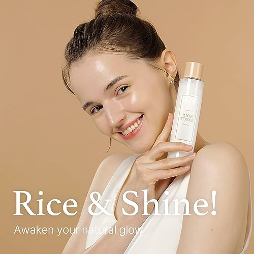 Smiling woman holding a rice toner bottle against a beige background.